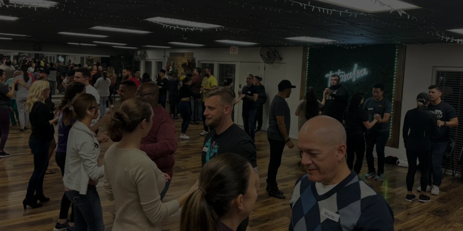 Students practicing partner dancing at the TaToSalsa studio