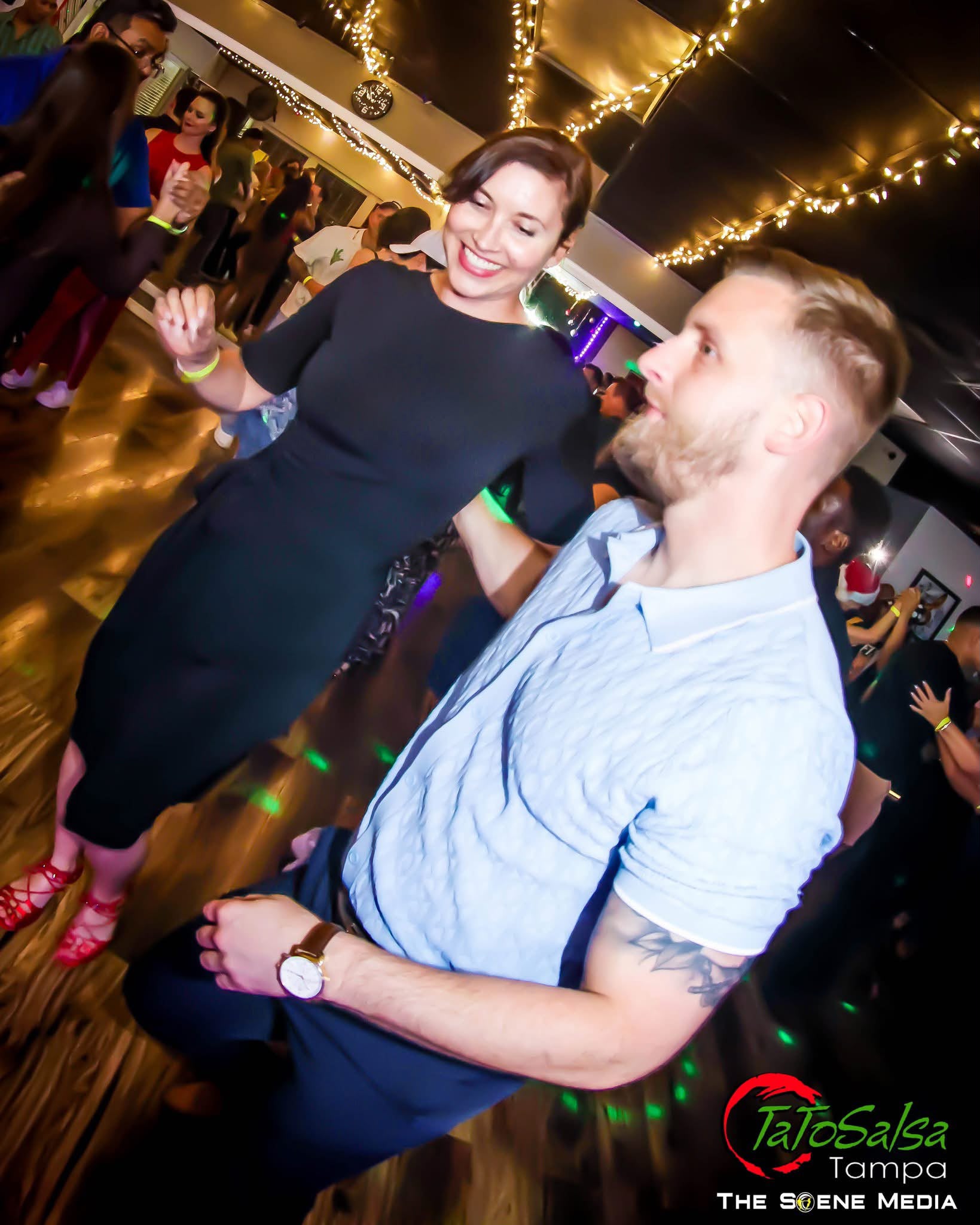 A couple dancing at a TaToSalsa social